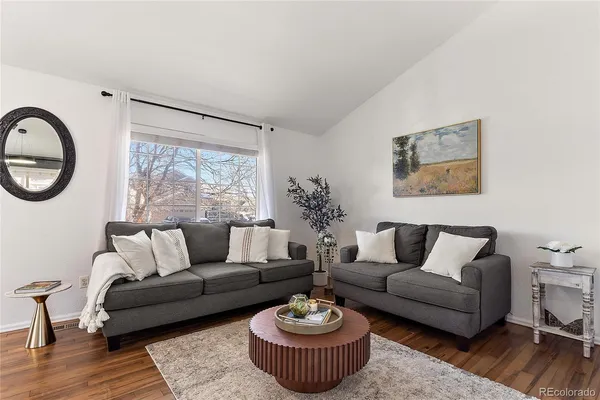a kitchen with granite countertop a sink cabinets and stainless steel appliances