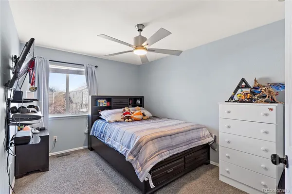 a bedroom with bed and a closet