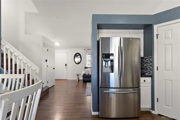a kitchen with stainless steel appliances a refrigerator stove and microwave