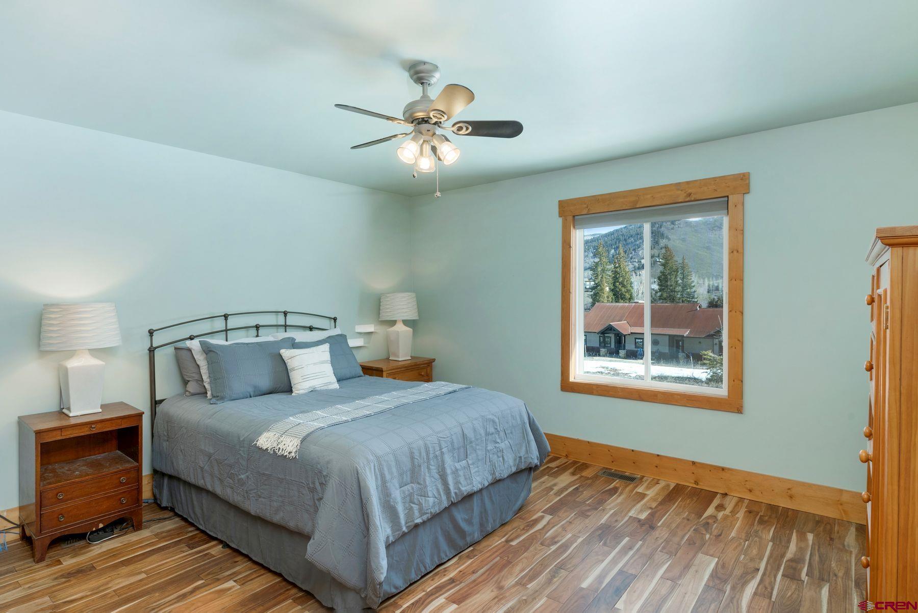 86 Jacquelyn Lane Crested Butte, CO 81224 - Photo 11 of 29 a bedroom with a large bed and a window
