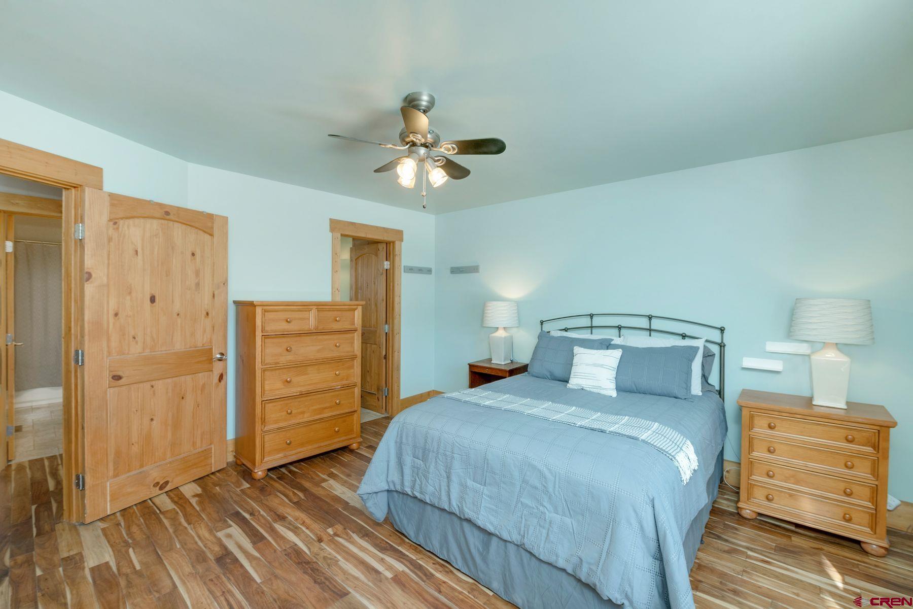86 Jacquelyn Lane Crested Butte, CO 81224 - Photo 12 of 29 a bedroom with a bed and cabinets