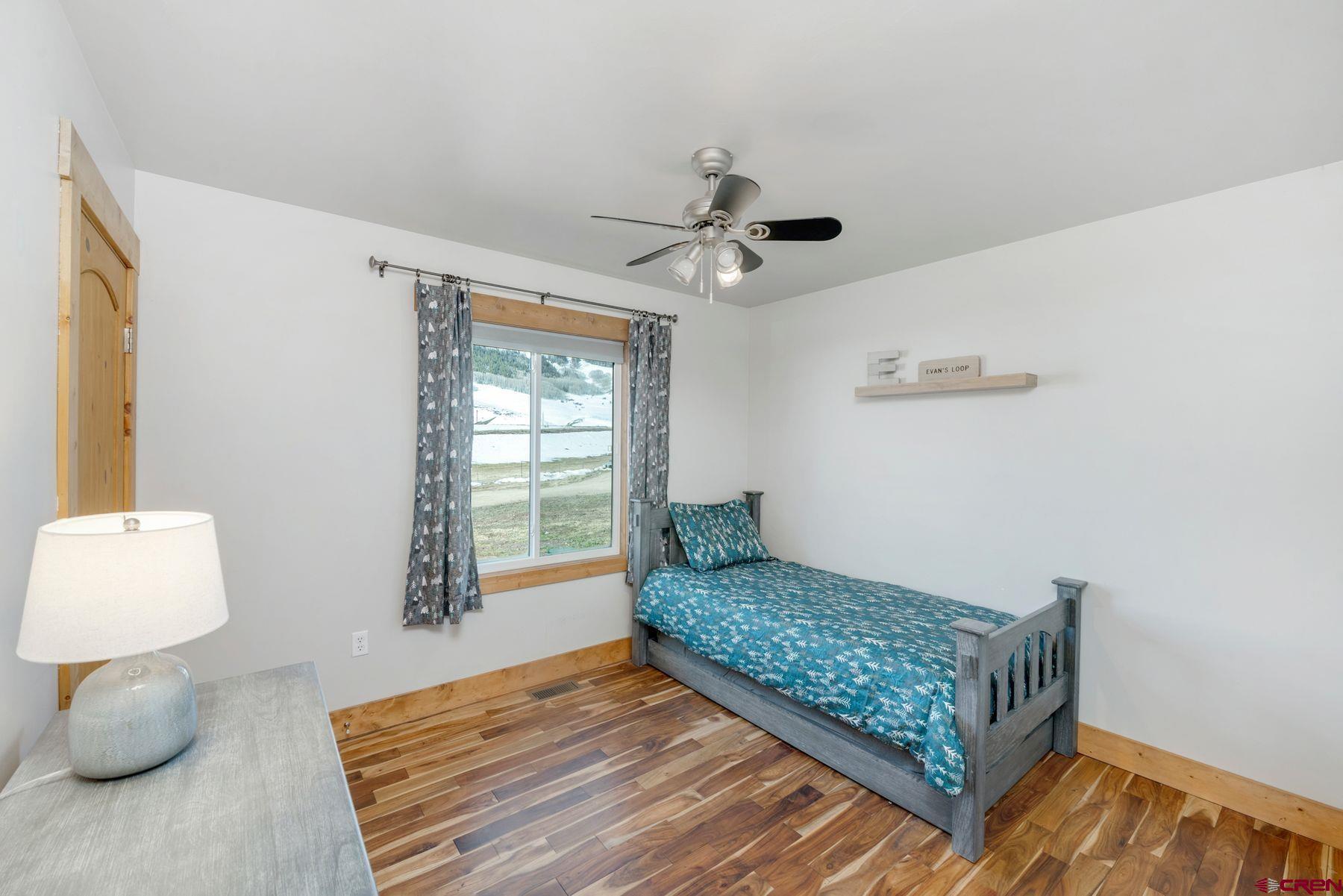 86 Jacquelyn Lane Crested Butte, CO 81224 - Photo 17 of 29 a bedroom with furniture and a window