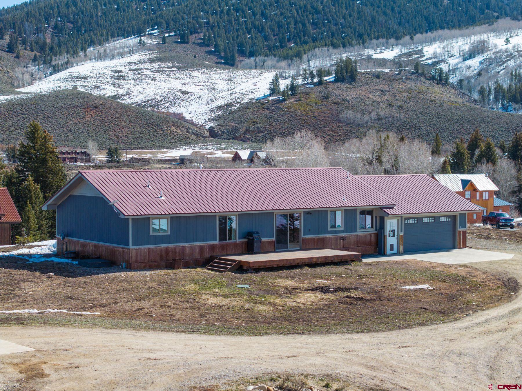 86 Jacquelyn Lane Crested Butte, CO 81224 - Photo 2 of 29 a front view of a house with a yard