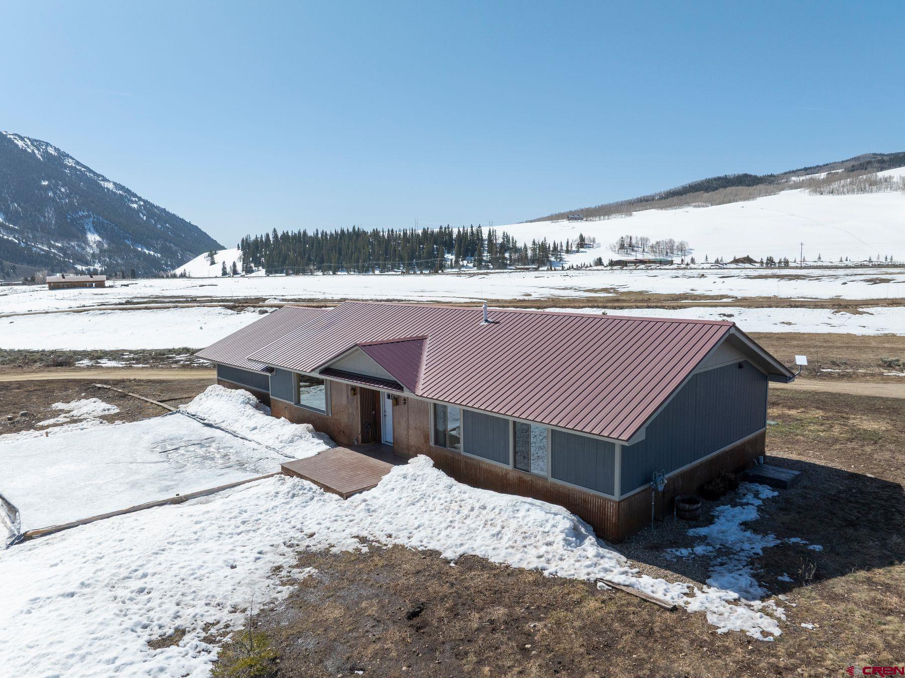 86 Jacquelyn Lane Crested Butte, CO 81224 - Photo 25 of 29 a view of a backyard with sitting area