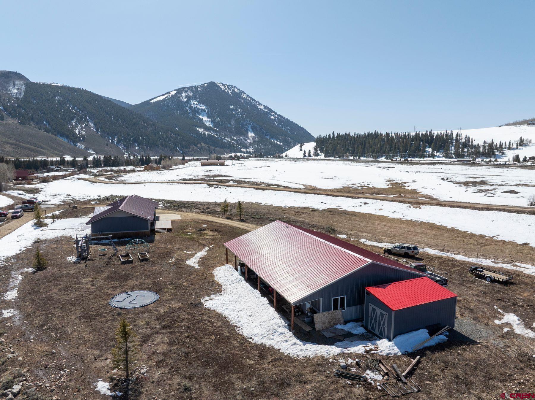 86 Jacquelyn Lane Crested Butte, CO 81224 - Photo 27 of 29 a view of a backyard with a table and chairs