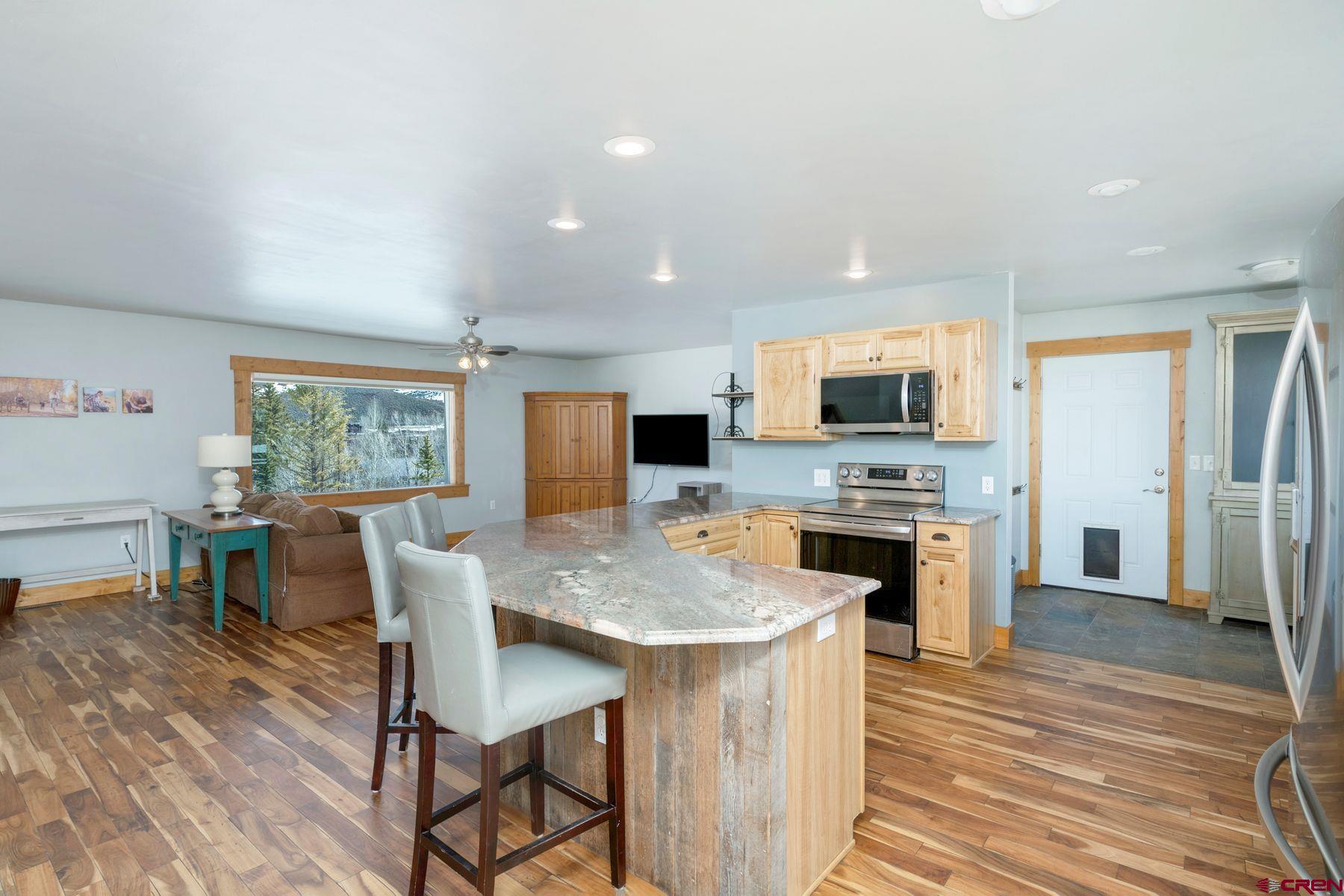 86 Jacquelyn Lane Crested Butte, CO 81224 - Photo 5 of 29 a view of a dining room with furniture window and wooden floor