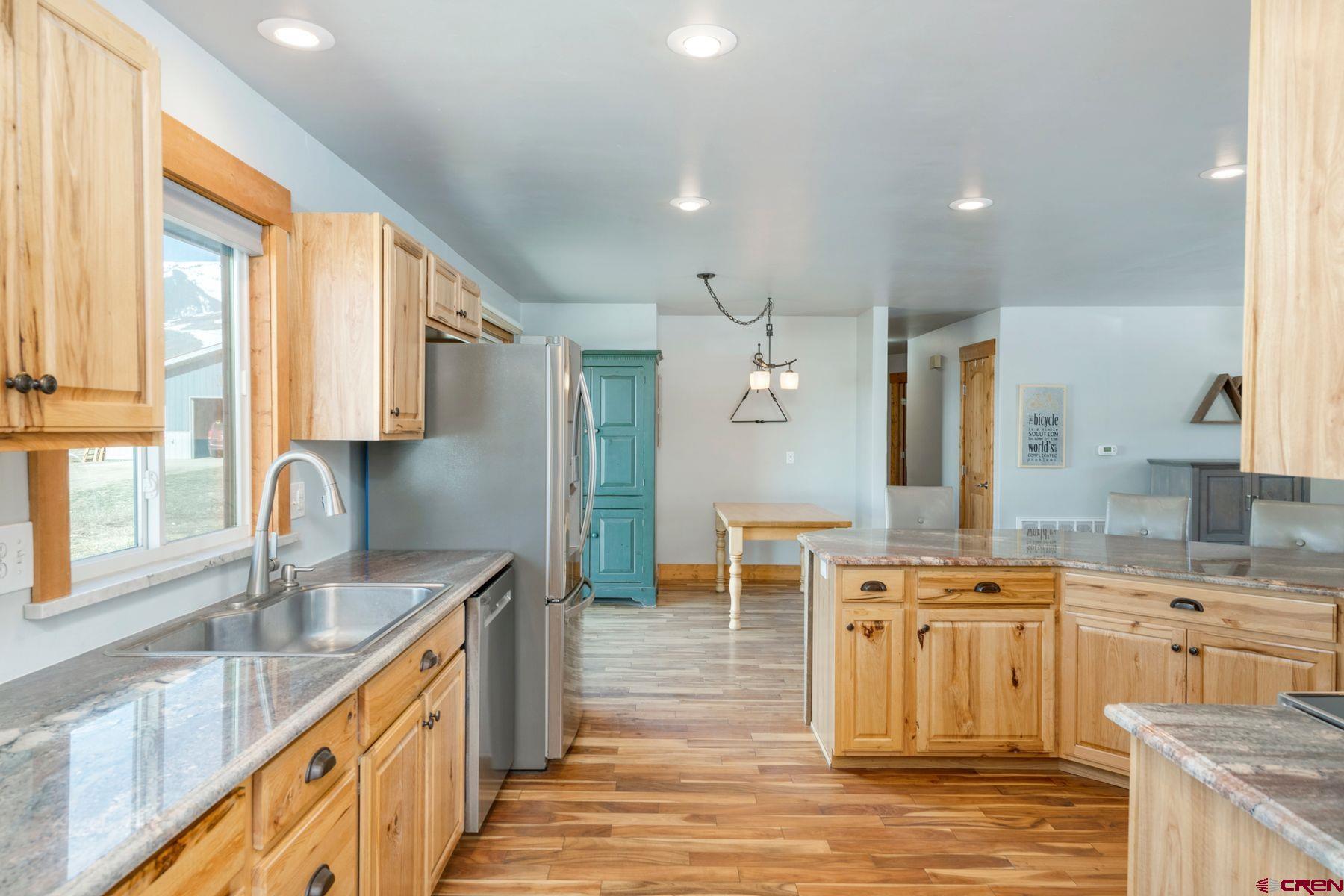 86 Jacquelyn Lane Crested Butte, CO 81224 - Photo 6 of 29 a kitchen with stainless steel appliances granite countertop a sink stove and cabinets