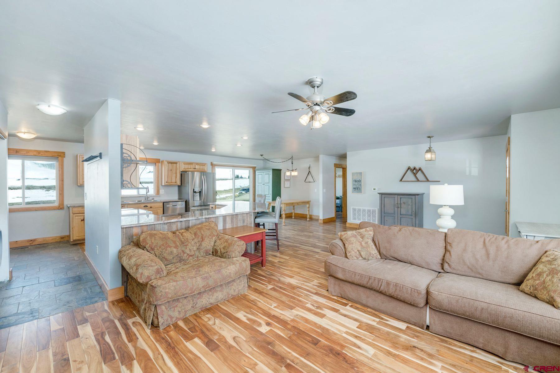 86 Jacquelyn Lane Crested Butte, CO 81224 - Photo 8 of 29 a living room with furniture and a chandelier