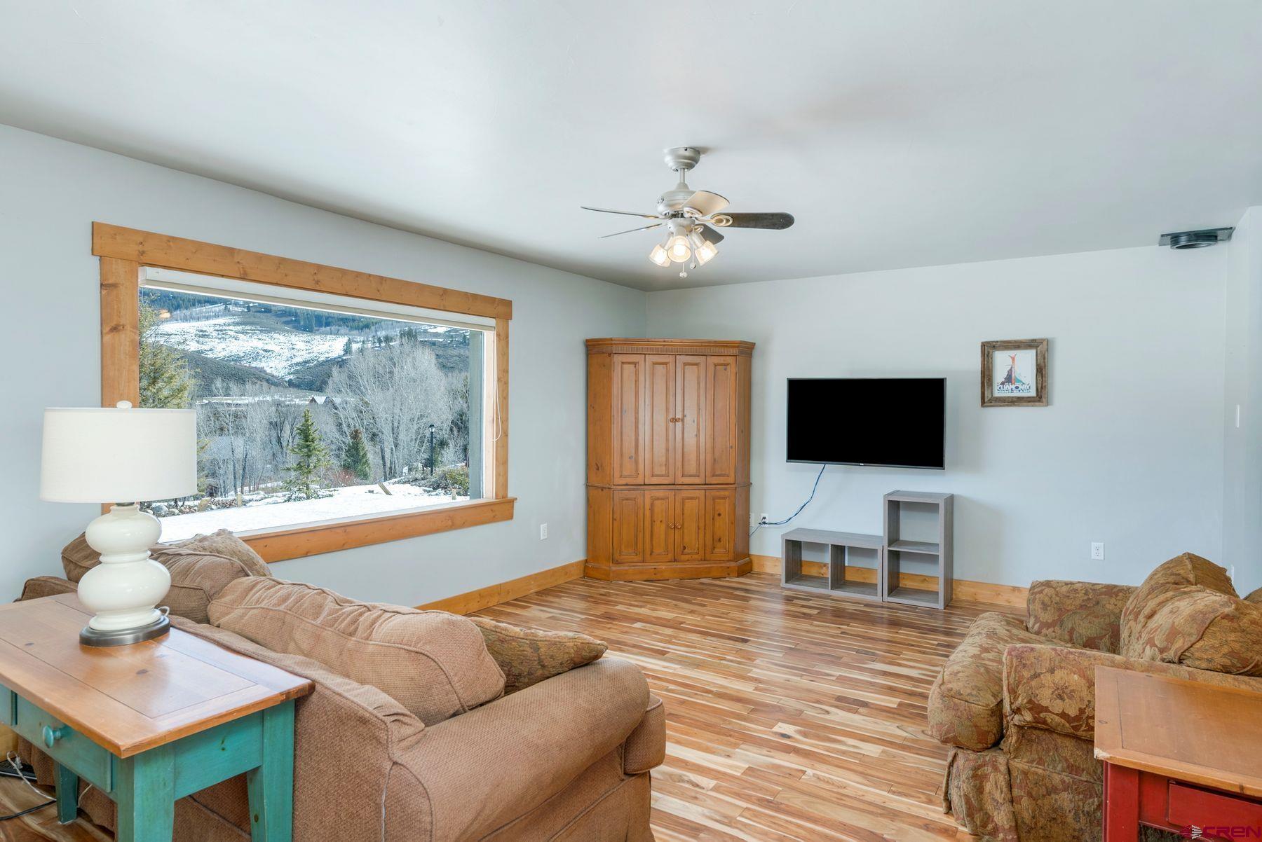 86 Jacquelyn Lane Crested Butte, CO 81224 - Photo 9 of 29 a living room with furniture and a flat screen tv