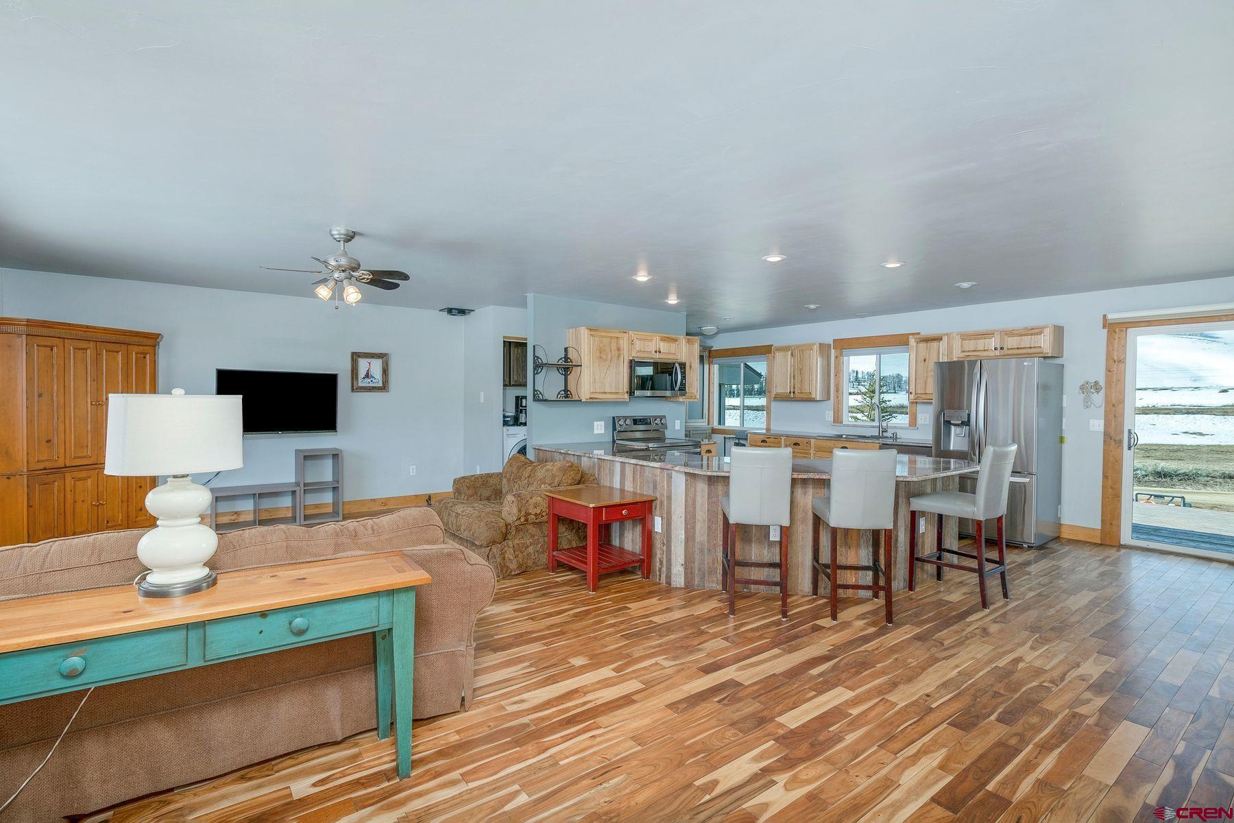 86 Jacquelyn Lane Crested Butte, CO 81224 - Photo 10 of 29 a living room with furniture and a flat screen tv