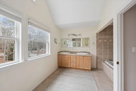 a room with a stove top oven and a sink