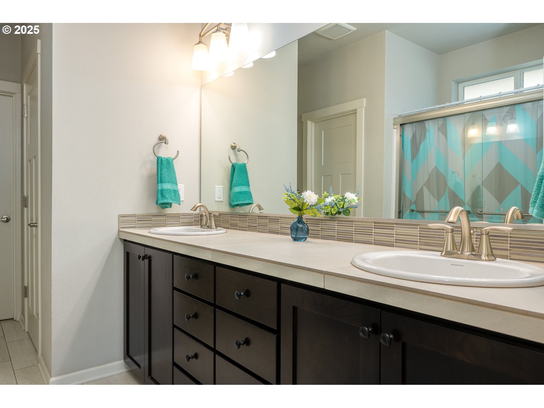 2314 Southwest 43rd Street Gresham, OR 97080 - Photo 21 of 36 a bathroom with a double vanity sink and a mirror