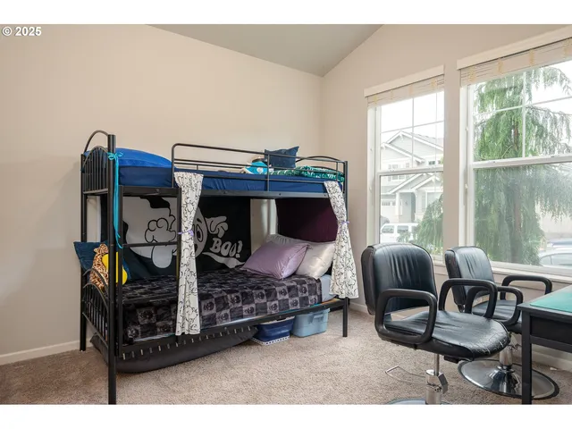 a living room with furniture a window and a fireplace