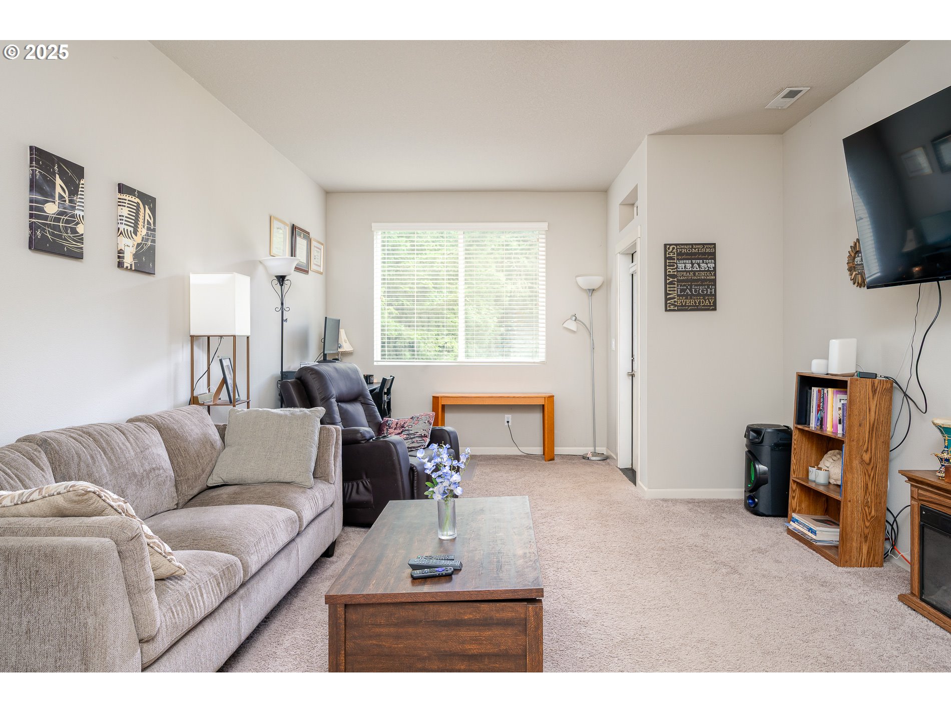 2314 Southwest 43rd Street Gresham, OR 97080 - Photo 30 of 36 a living room with furniture and a flat screen tv
