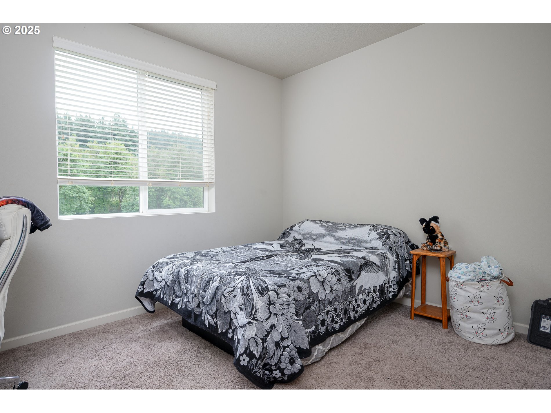 2314 Southwest 43rd Street Gresham, OR 97080 - Photo 36 of 36 a bed sitting in a bedroom next to a window