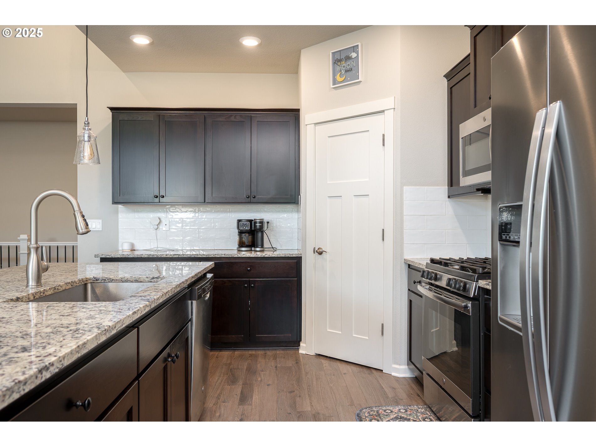 2314 Southwest 43rd Street Gresham, OR 97080 - Photo 8 of 36 a kitchen with a refrigerator sink and stove