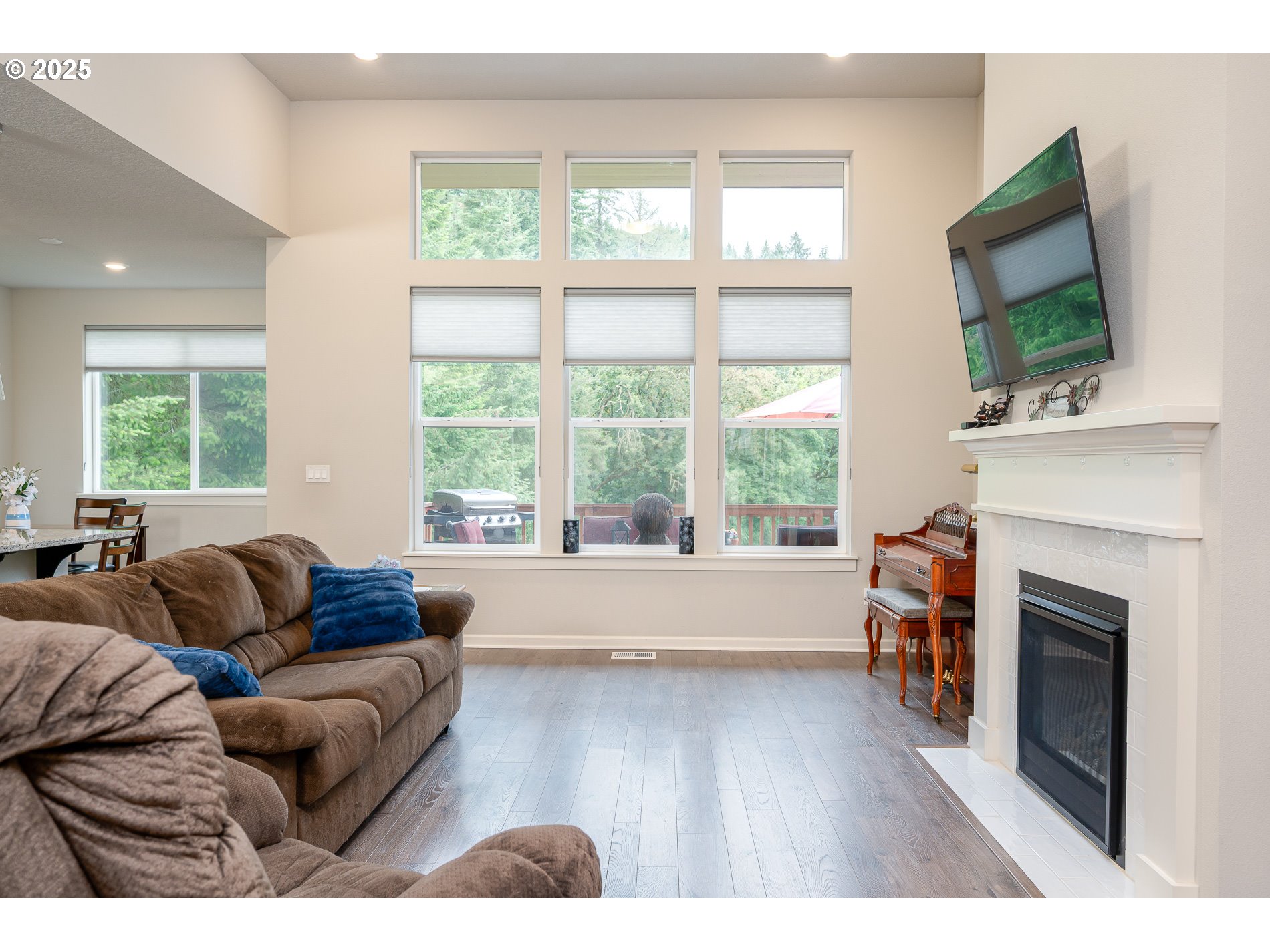 2314 Southwest 43rd Street Gresham, OR 97080 - Photo 10 of 36 a living room with furniture a flat screen tv and a fireplace