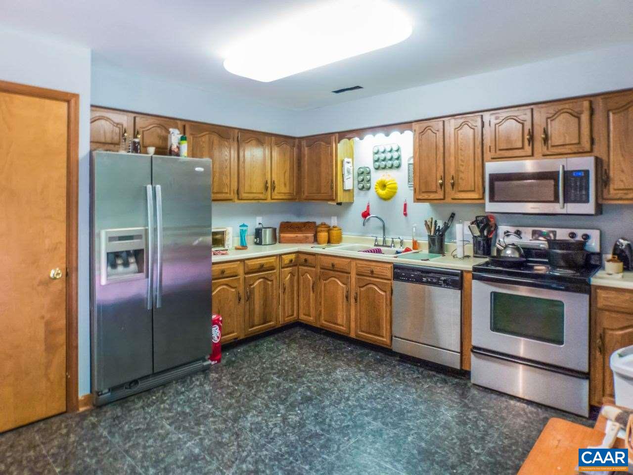 502 Bybees Church Road Palmyra, VA 22963 - Photo 5 of 15 a kitchen with granite countertop a sink a counter top space stainless steel appliances and cabinets