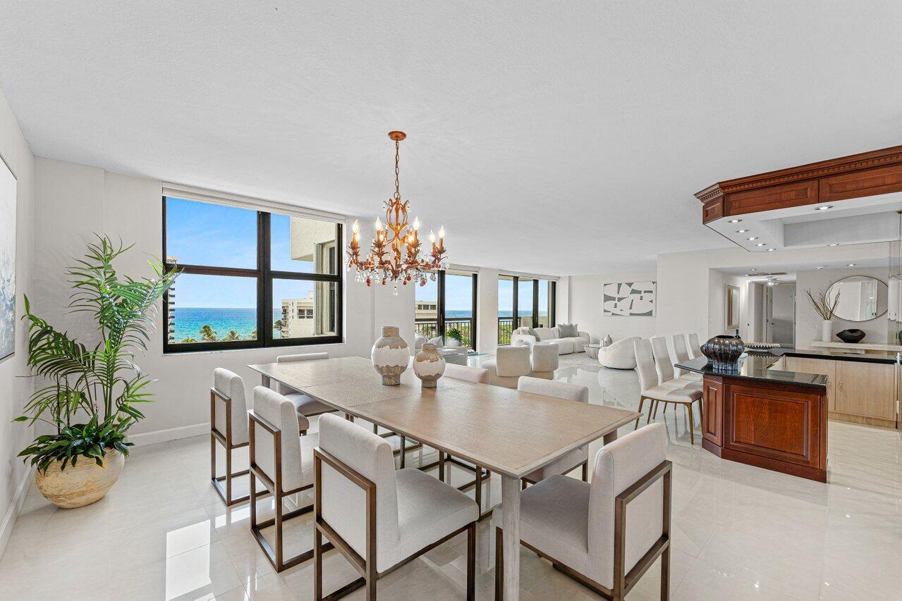 2003 North Ocean Boulevard, Unit 902 Boca Raton, FL 33431 - Photo 17 of 45 a view of a dining room with furniture window and wooden floor