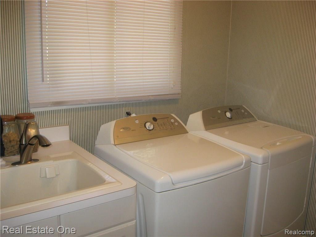 6985 Longwood Road Canton, MI 48187 - Photo 23 of 30 Bright first floor laundry with laundry tub!