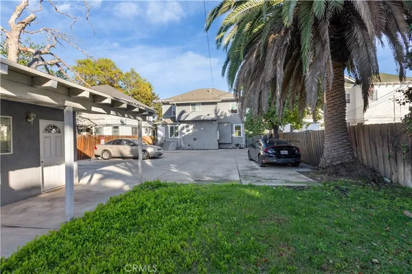 a view of a backyard with furniture