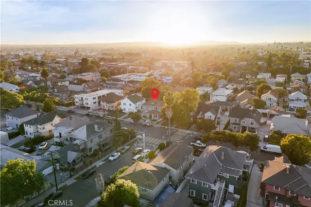 an aerial view of residential building with parking