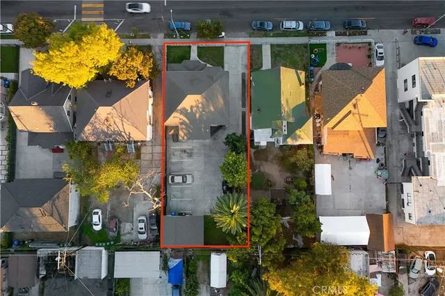 an aerial view of multiple houses with yard