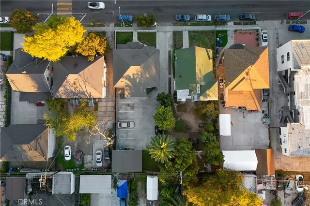 an aerial view of houses with outdoor space
