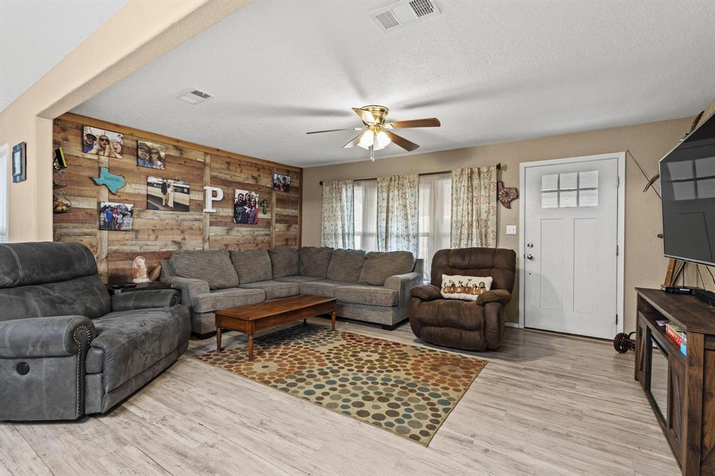 469 Dugan Chapel Road Bells, TX 75414 - Photo 15 of 33 a living room with furniture and a flat screen tv