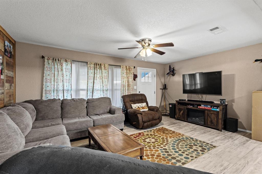 469 Dugan Chapel Road Bells, TX 75414 - Photo 18 of 33 a living room with furniture and a flat screen tv