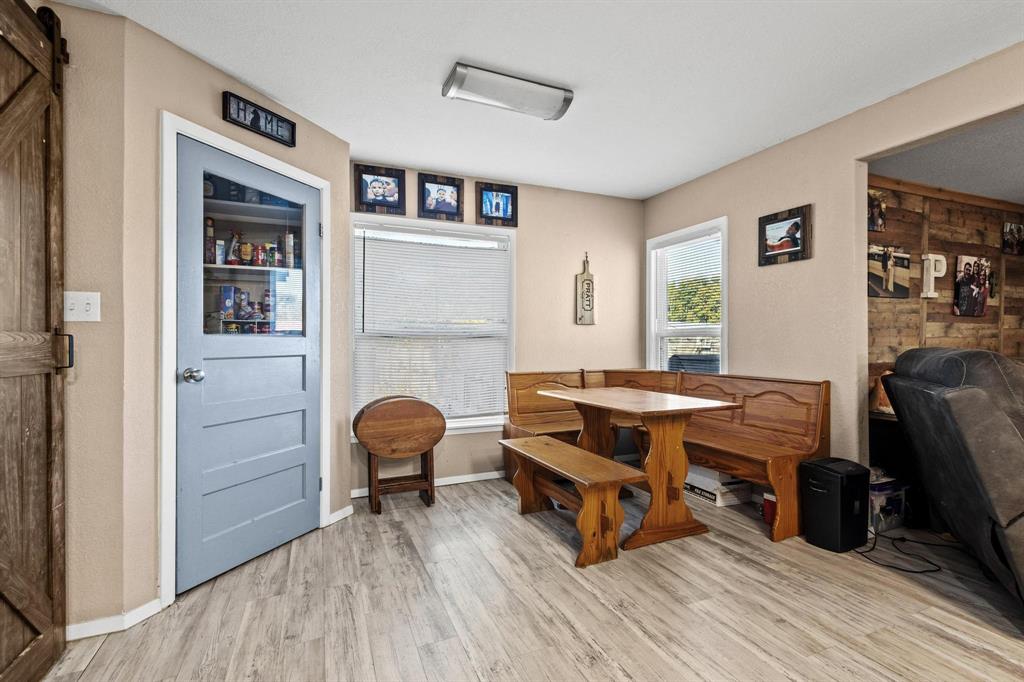 469 Dugan Chapel Road Bells, TX 75414 - Photo 19 of 33 a room with wooden floor and furniture