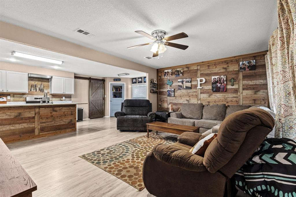 469 Dugan Chapel Road Bells, TX 75414 - Photo 20 of 33 a living room with furniture and a fireplace