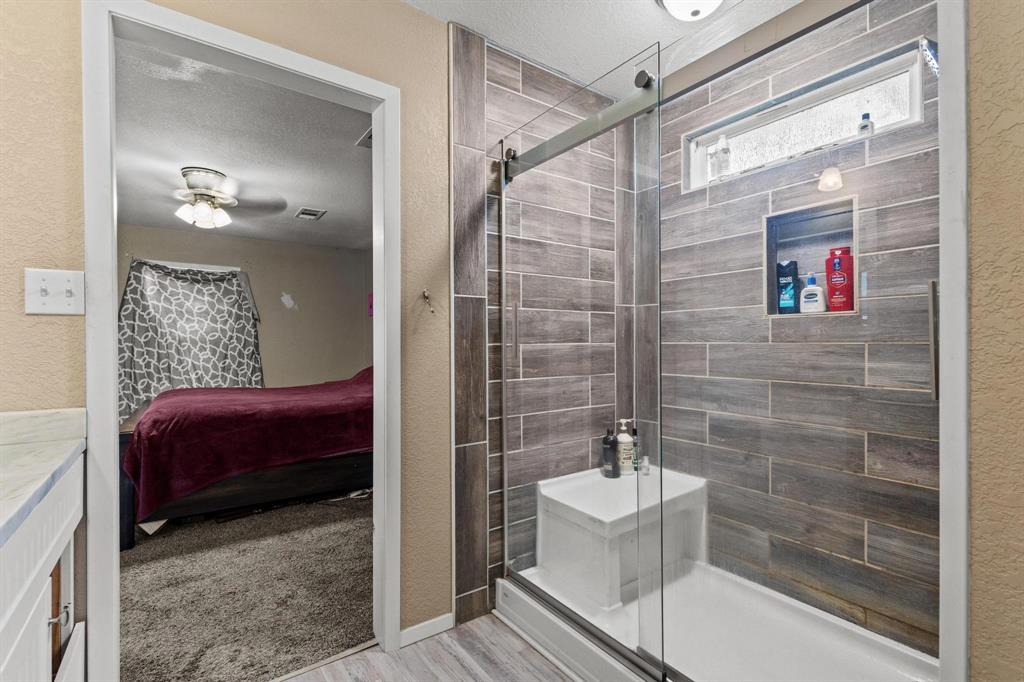 469 Dugan Chapel Road Bells, TX 75414 - Photo 26 of 33 a bathroom with a shower and a sink