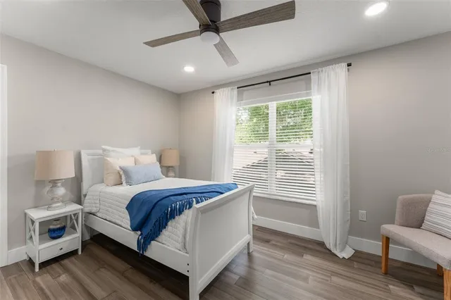 a aerial view of a house with a yard and potted plants