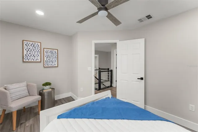 front view of a house with a yard and an trees