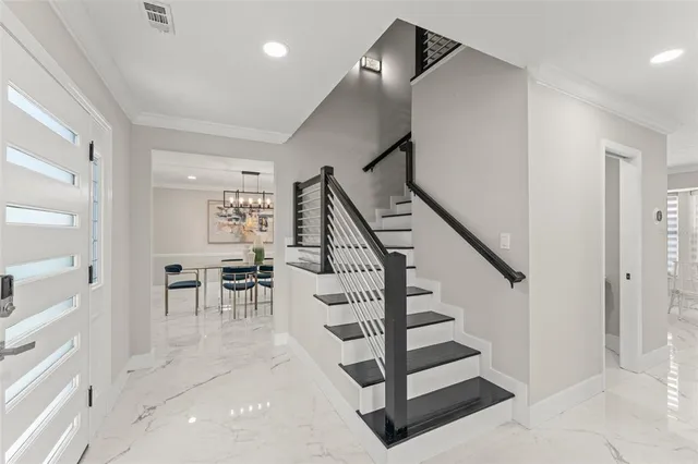a view of entryway and hall with dining room