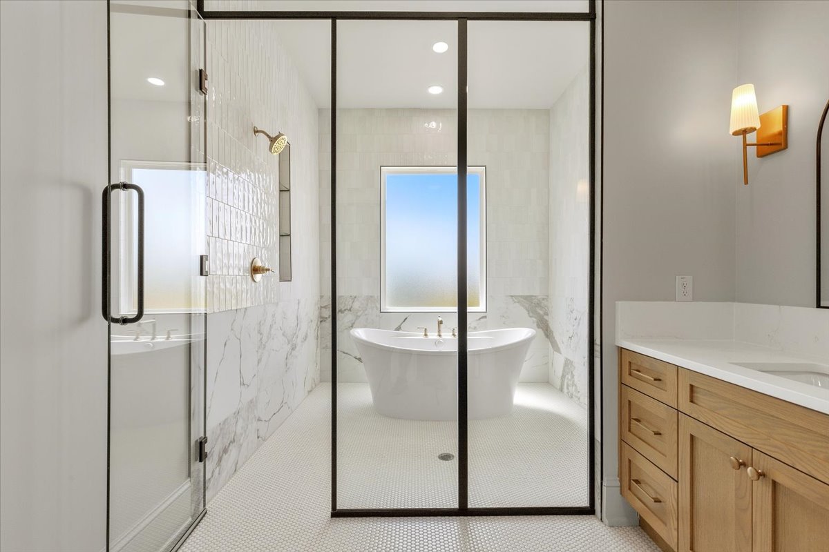 224 Sandia Loop Kingsland, TX 78639 - Photo 18 of 32 a bathroom with a tub and a shower