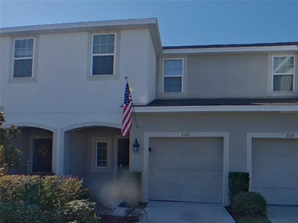 Undisclosed Address Riverview, FL 33578 - Photo 1 of 15 a front view of a house with a garage