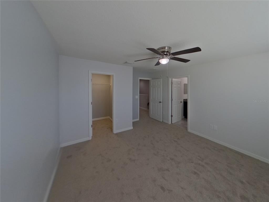 Undisclosed Address Riverview, FL 33578 - Photo 6 of 15 a view of an empty room with a ceiling fan and window