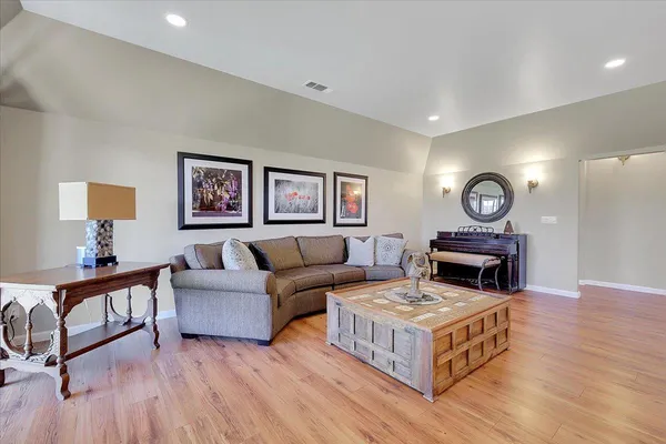 a view of a house with backyard and a tree