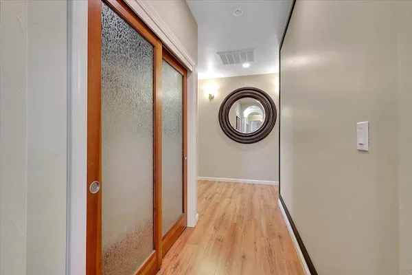 a view of walk in closet with empty racks