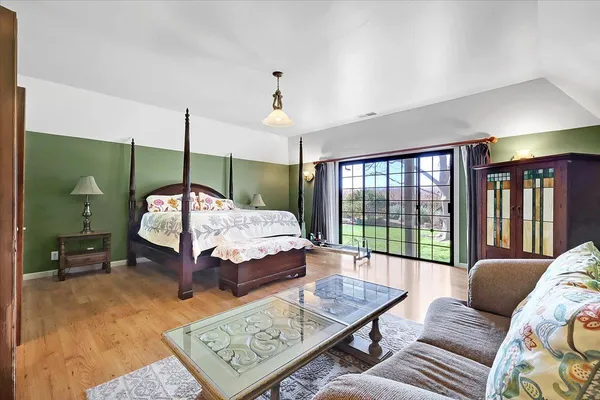 a living room with furniture and a ceiling fan