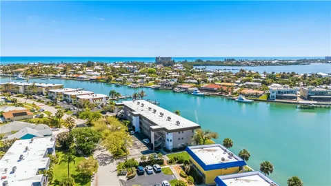 an aerial view of a house with a ocean view