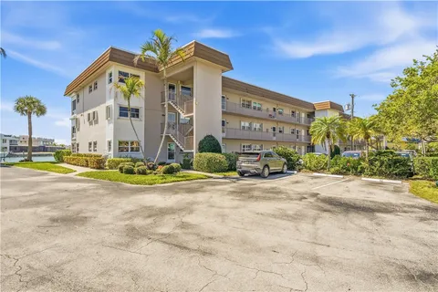 a view of a building with barbeque and plants