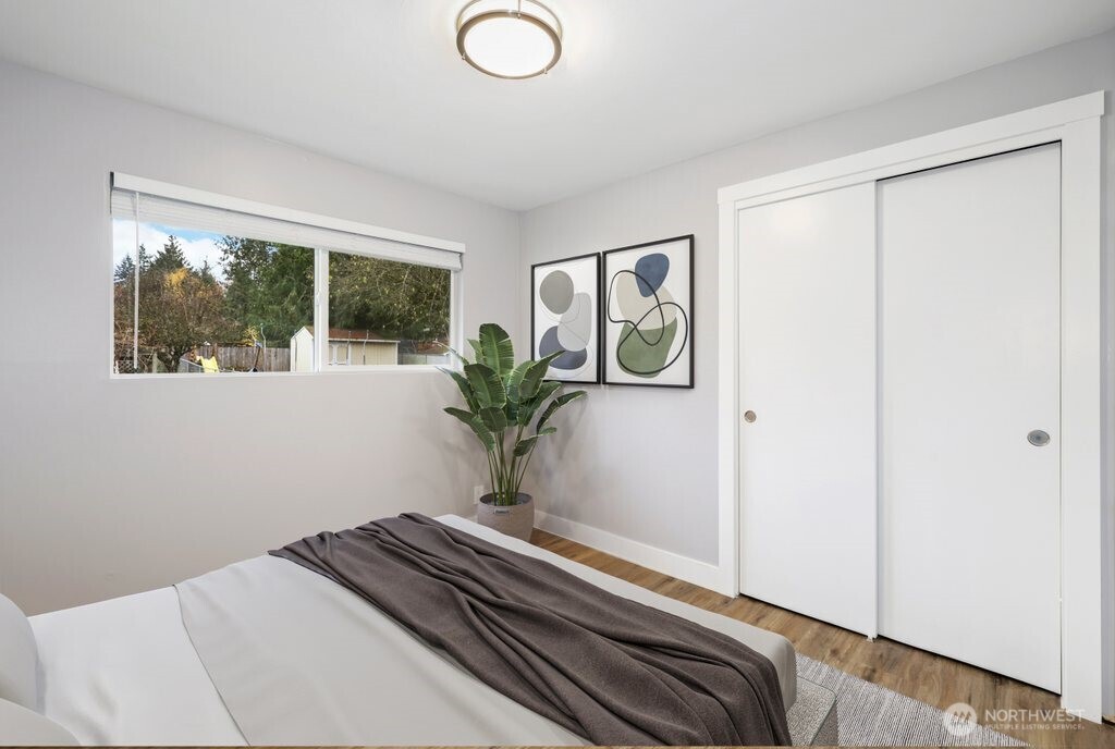 12637 Southeast 161st Street Renton, WA 98058 - Photo 11 of 37 a view of bedroom with wooden floor