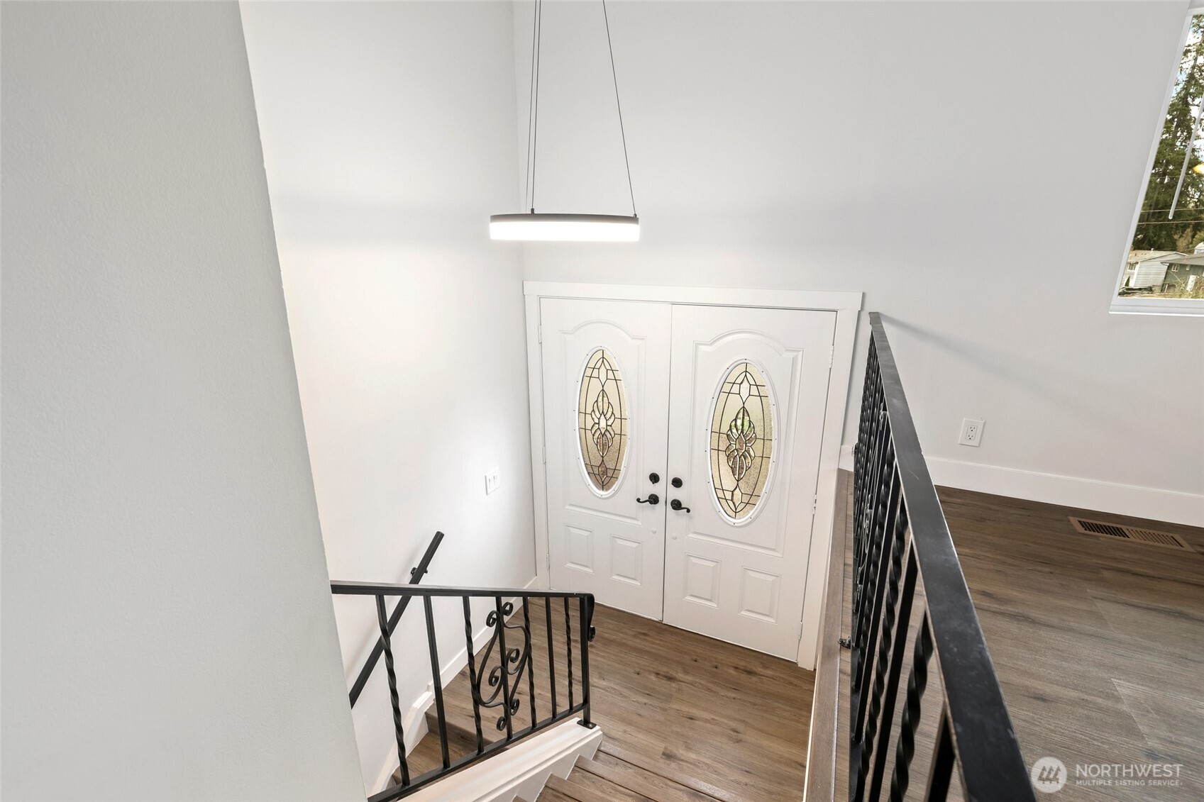 12637 Southeast 161st Street Renton, WA 98058 - Photo 16 of 37 a view of a hallway with wooden floor