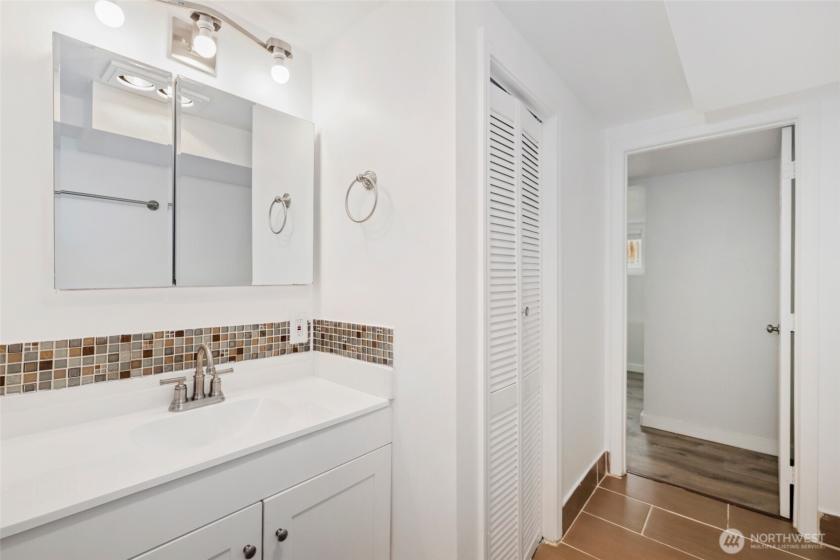 12637 Southeast 161st Street Renton, WA 98058 - Photo 19 of 37 a bathroom with a sink and a mirror