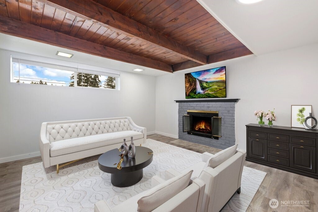 12637 Southeast 161st Street Renton, WA 98058 - Photo 21 of 37 a living room with furniture and a fireplace