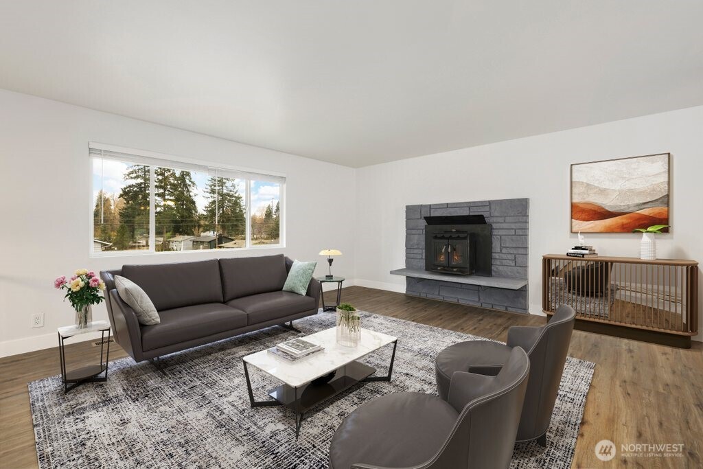 12637 Southeast 161st Street Renton, WA 98058 - Photo 3 of 37 a living room with furniture and a flat screen tv