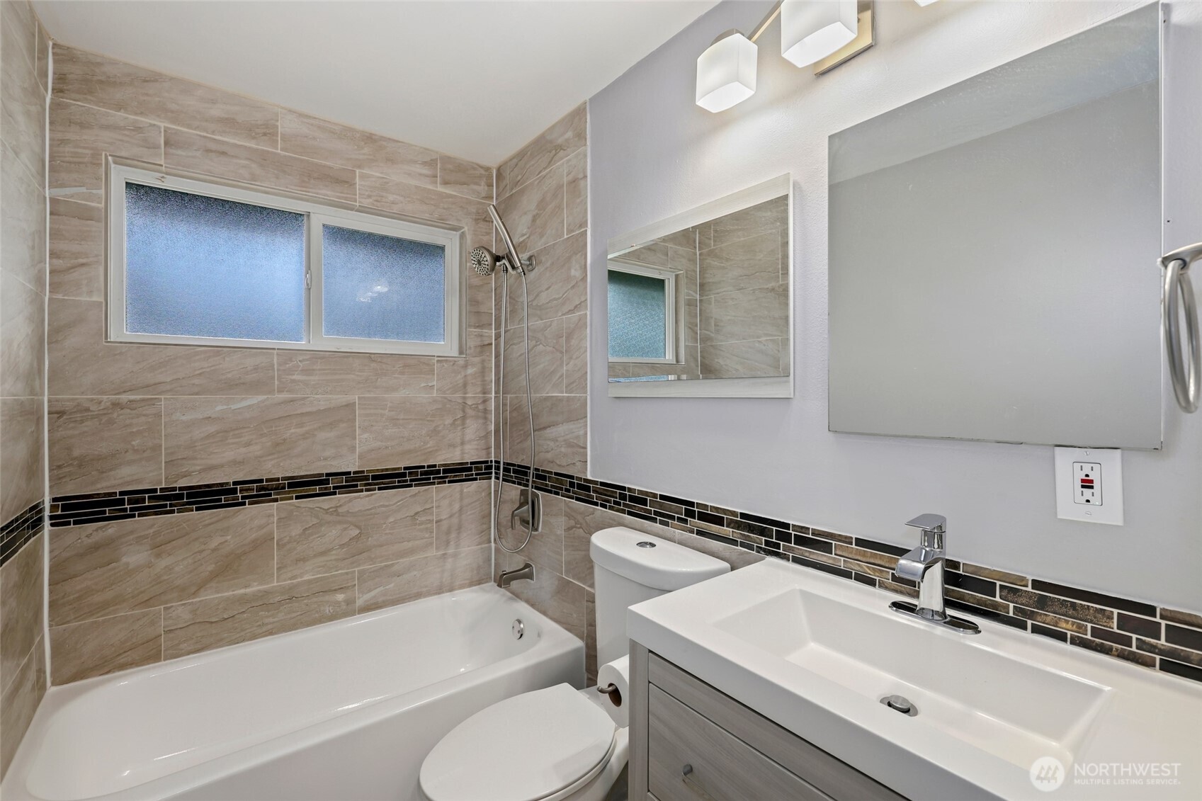 12637 Southeast 161st Street Renton, WA 98058 - Photo 10 of 37 a bathroom with a sink and a bathtub